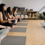 Person lying in relaxed body scan meditation pose